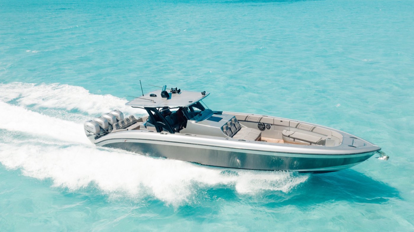 A sleek yacht cutting across turquoise water