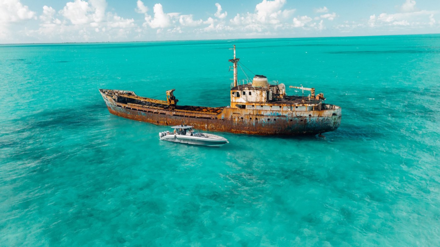 A yacht beside the La Famille Express shipwreck seen from above