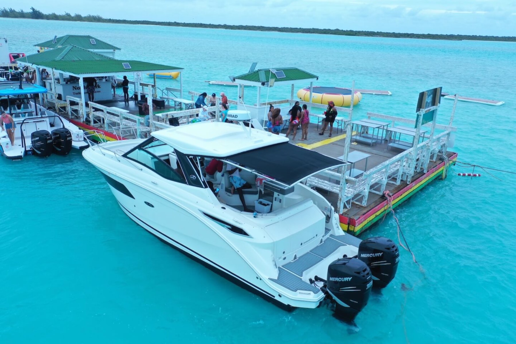 A private yacht moored alongside the Noah's Ark floating bar